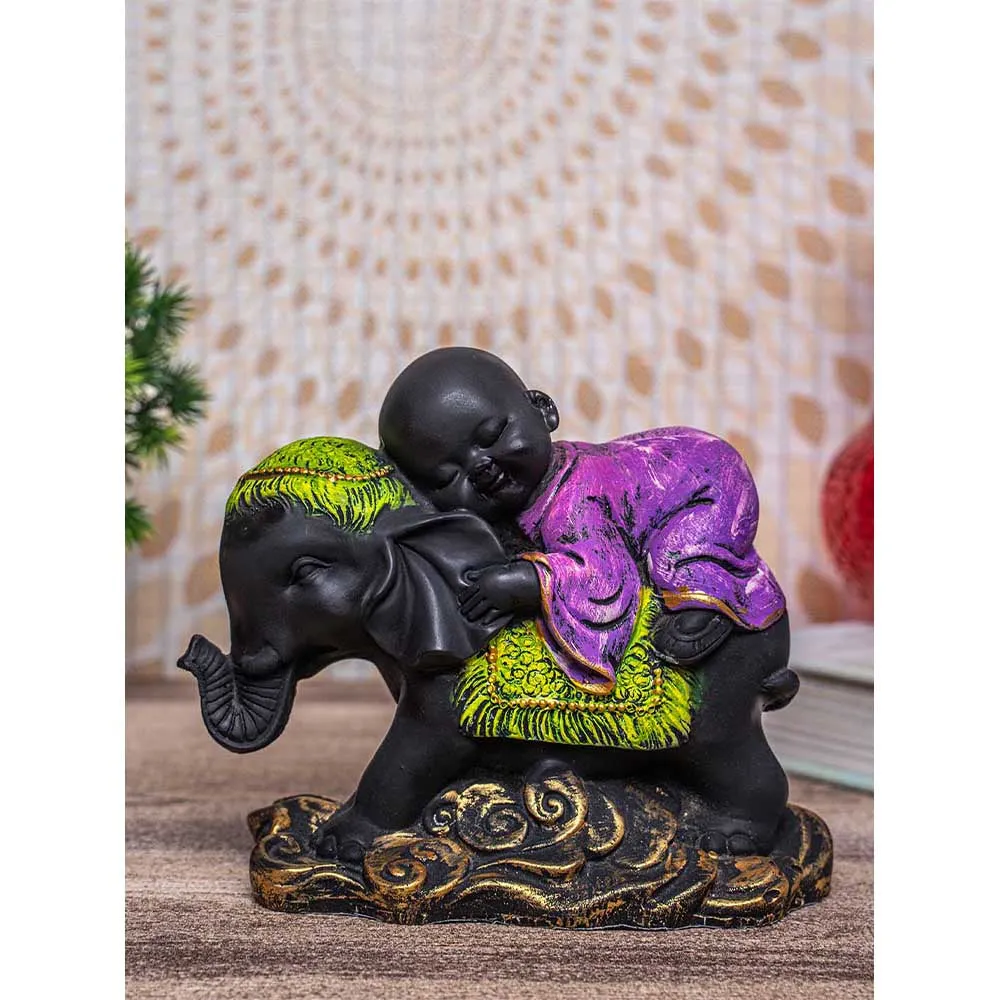 Cute Monk In Purple Sleeping On Black Elephant Decorative Showpiece